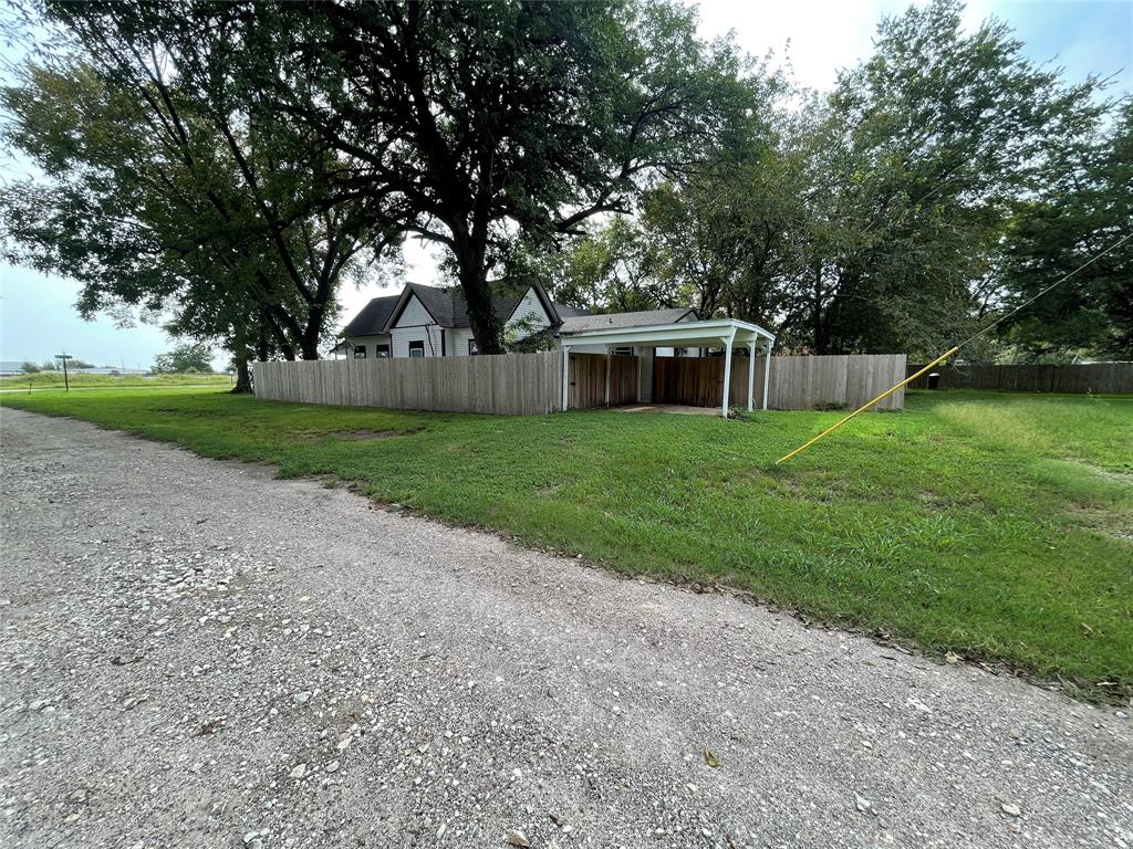 200 Austin Street Rice, TX 75155 - Photo 20 of 22 a house with huge green field in front of it