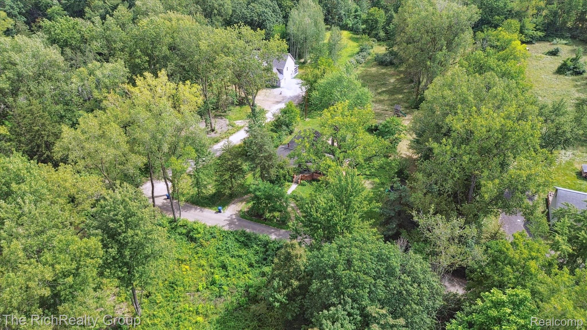 39635 Lotzford Road Canton, MI 48187 - Photo 37 of 39 Drone / aerial view of a heavily wooded area