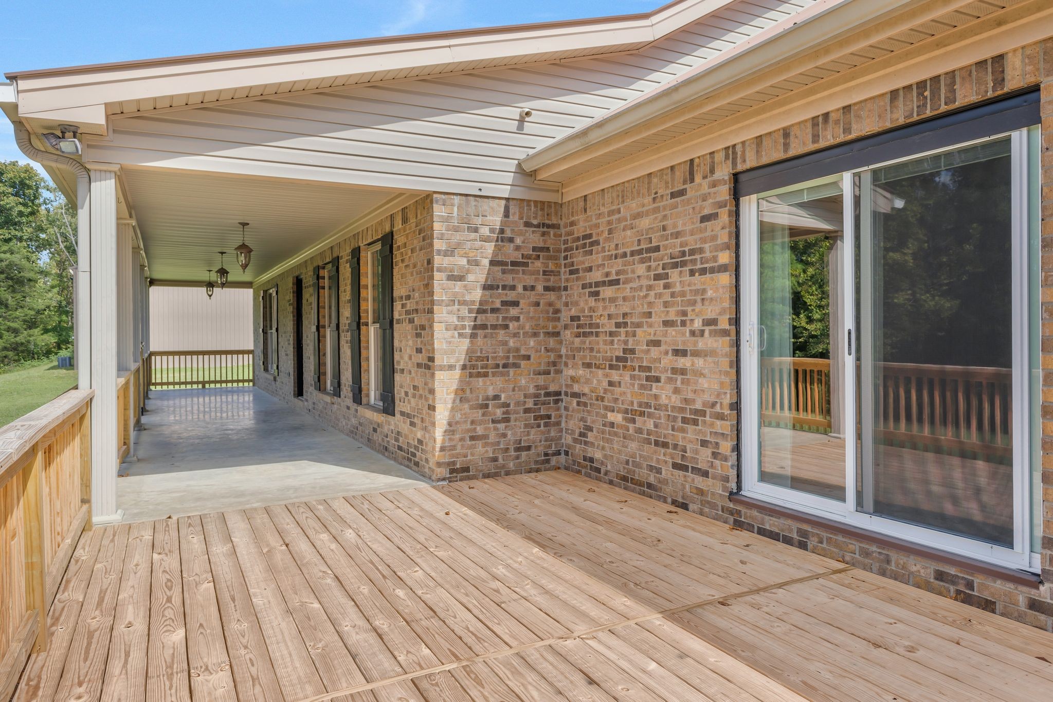 1745 Ennis Branch Road McEwen, TN 37101 - Photo 13 of 85 a view of a porch with wooden floor and iron stairs