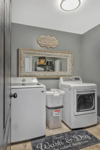 a view of a livingroom with furniture and a flat screen tv