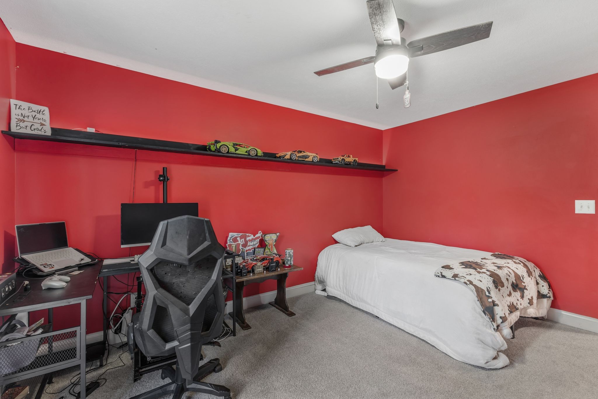 1745 Ennis Branch Road McEwen, TN 37101 - Photo 21 of 85 a bedroom with a bed a desk and chair with wooden floor