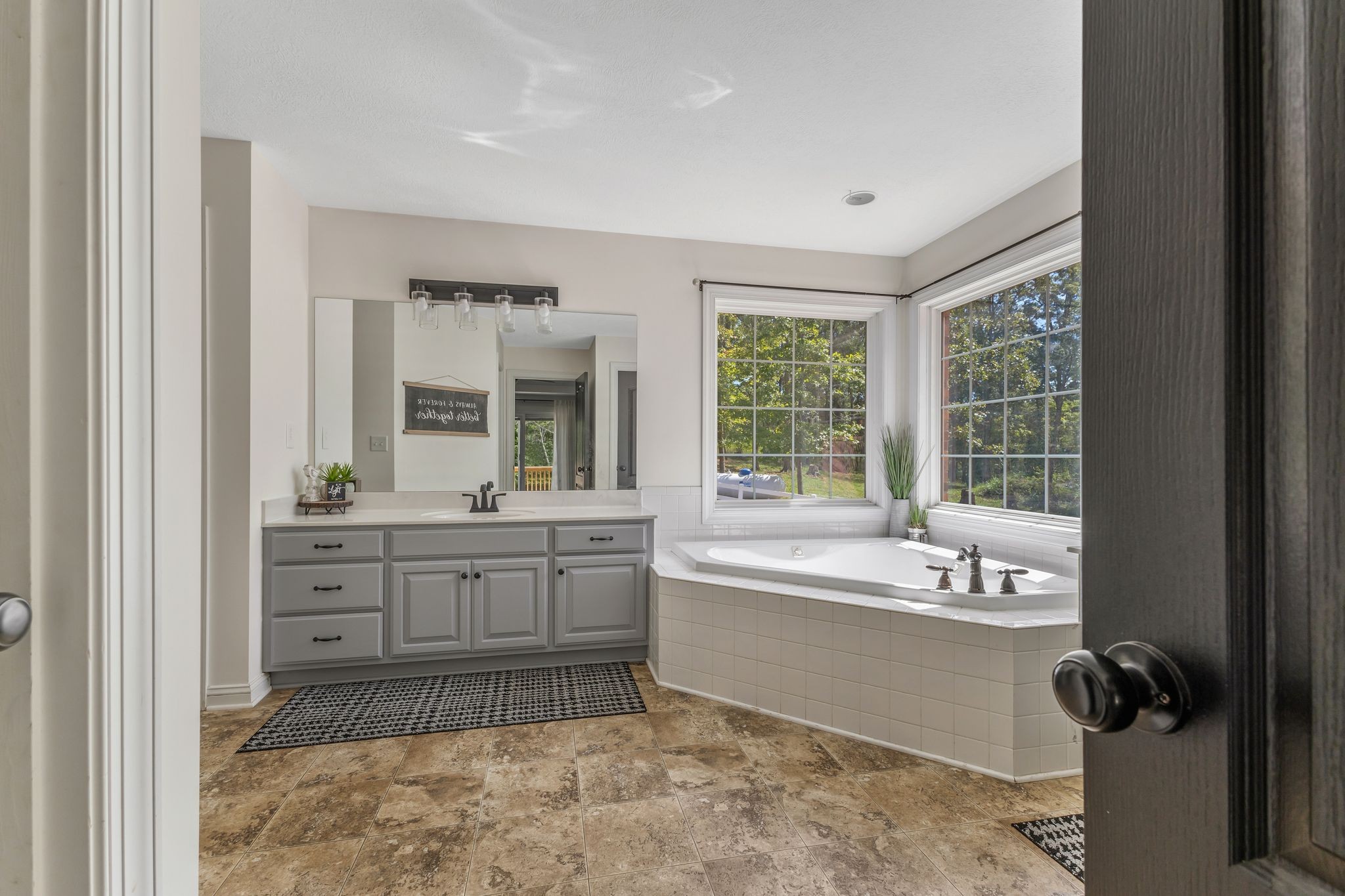 1745 Ennis Branch Road McEwen, TN 37101 - Photo 27 of 85 a spacious bathroom with a tub sink and mirror