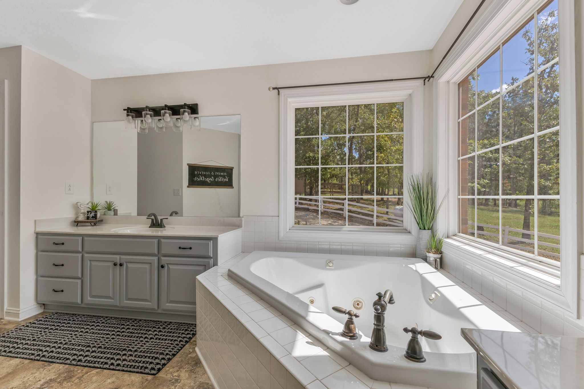 1745 Ennis Branch Road McEwen, TN 37101 - Photo 29 of 85 a bath tub sitting in a bathroom next to a window