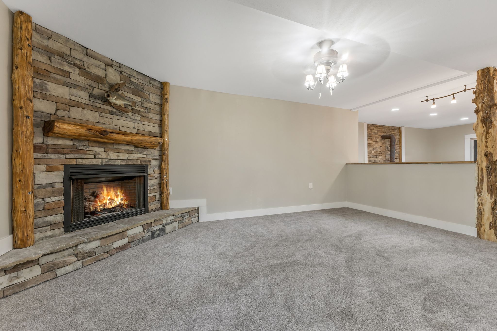 1745 Ennis Branch Road McEwen, TN 37101 - Photo 36 of 85 a view of an empty room with a fireplace and a fan
