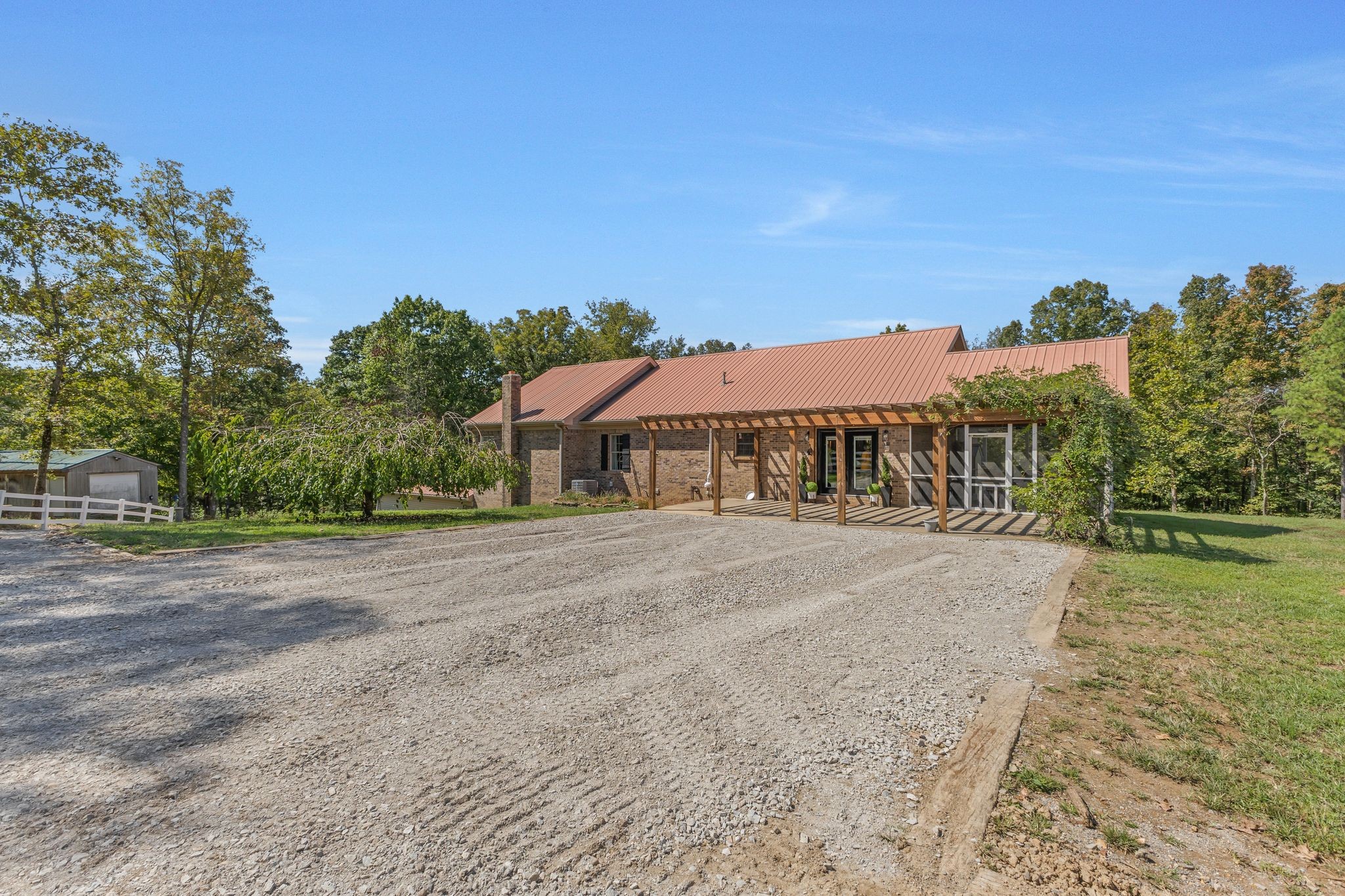 1745 Ennis Branch Road McEwen, TN 37101 - Photo 54 of 85 a front view of a house with a yard and trees