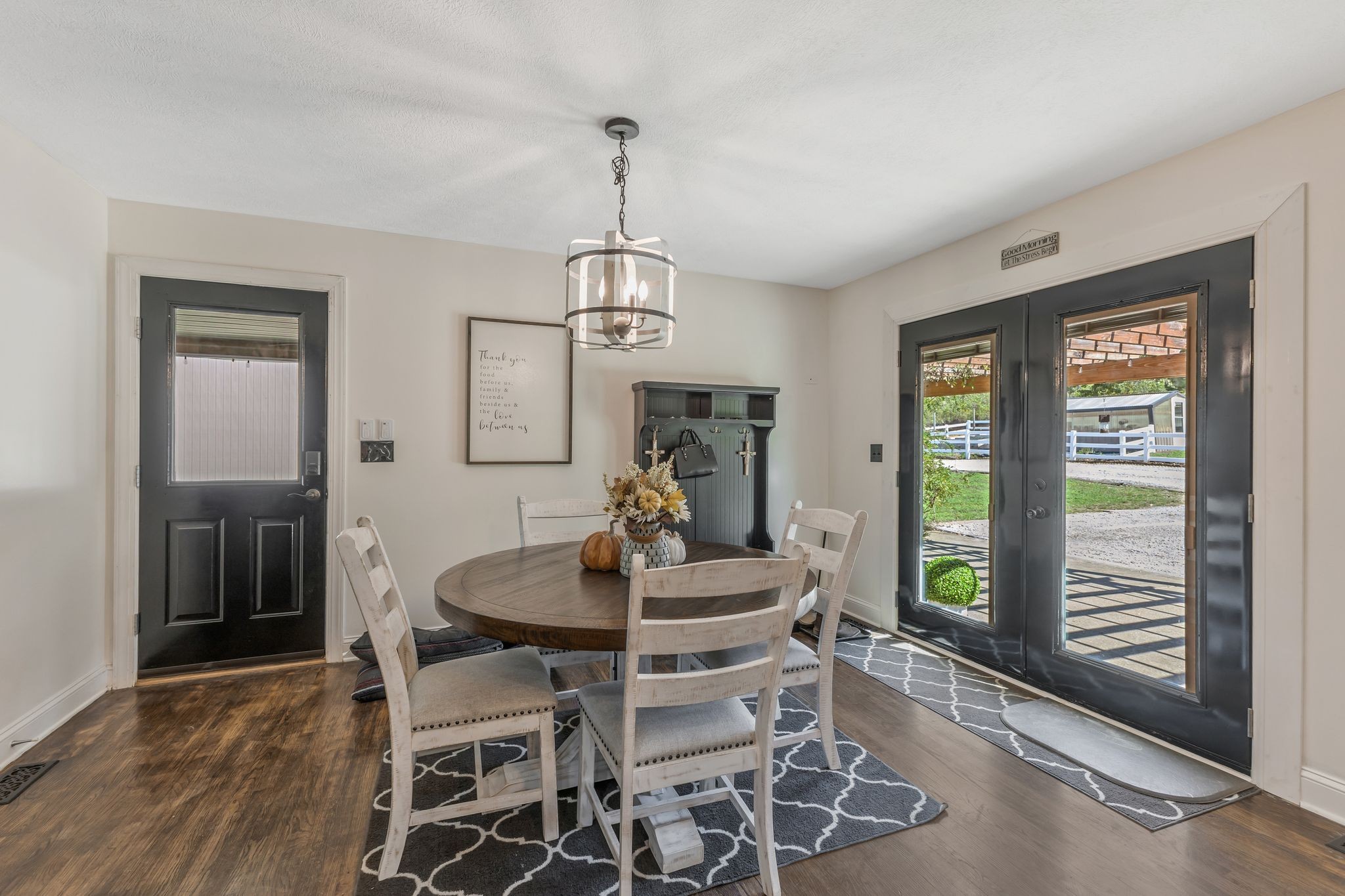1745 Ennis Branch Road McEwen, TN 37101 - Photo 6 of 85 a dining room with furniture a chandelier and wooden floor