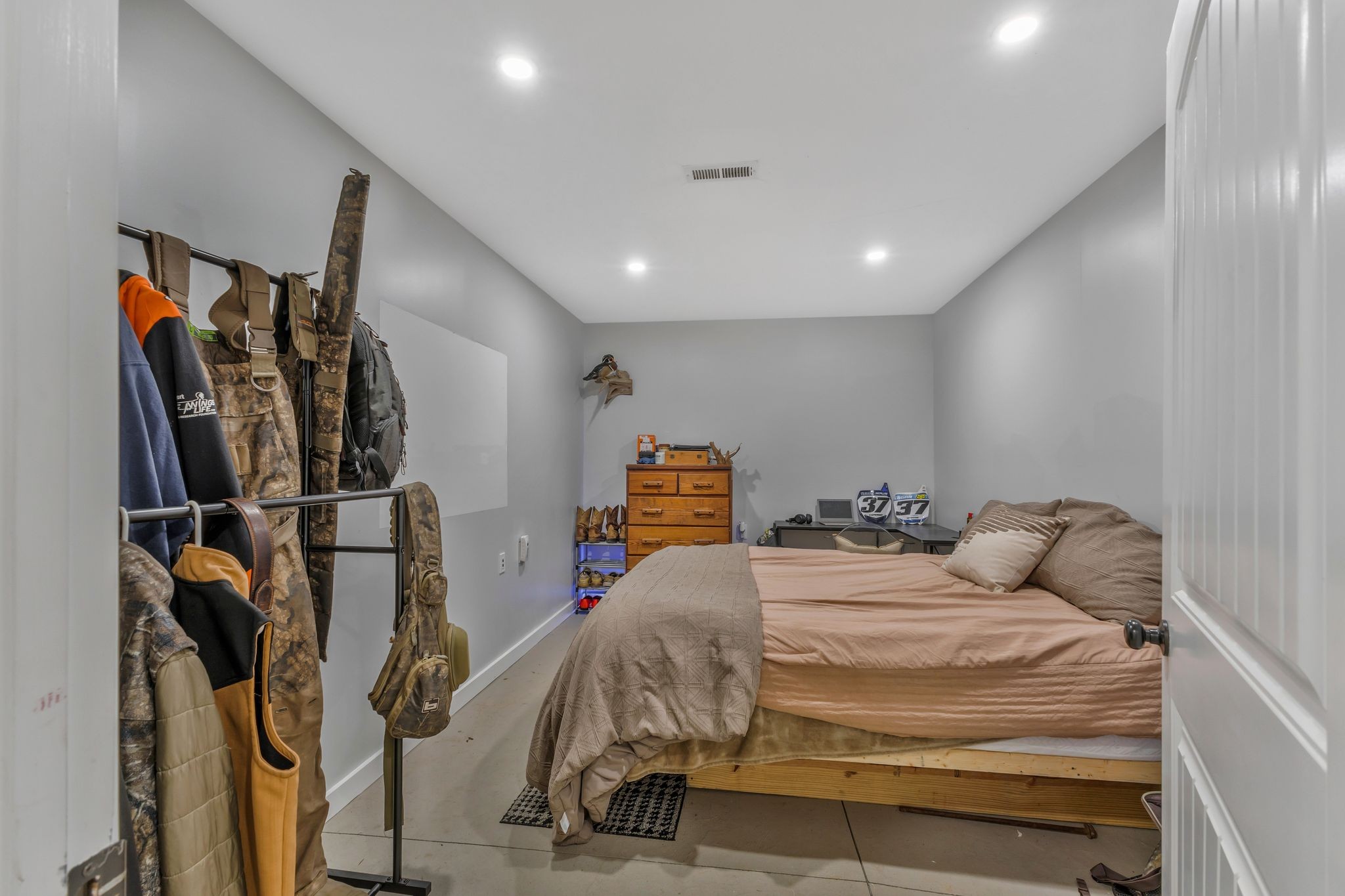 1745 Ennis Branch Road McEwen, TN 37101 - Photo 66 of 85 a bedroom with a bed and walk in closet