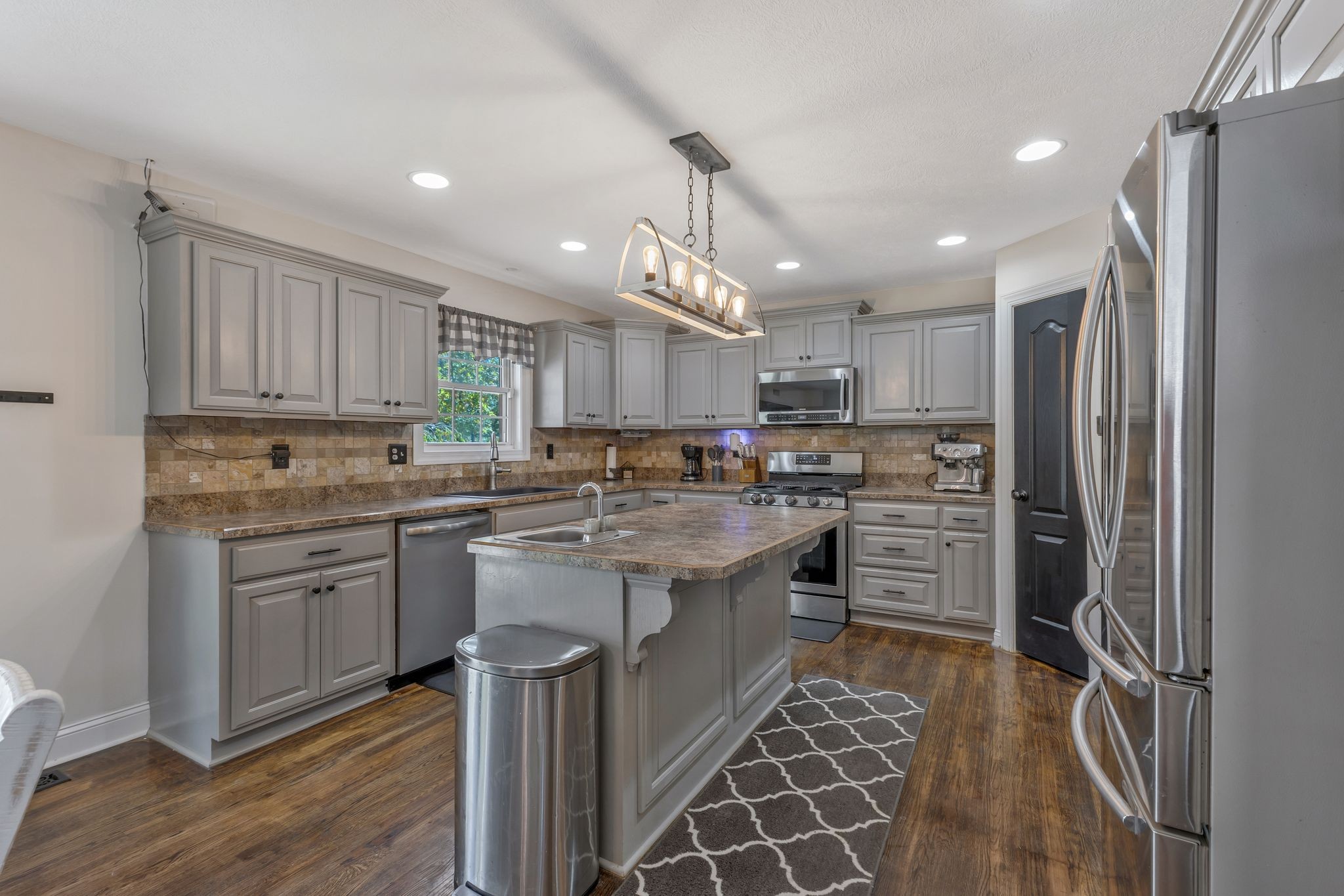 1745 Ennis Branch Road McEwen, TN 37101 - Photo 7 of 85 a kitchen with stainless steel appliances granite countertop a refrigerator and a stove top oven