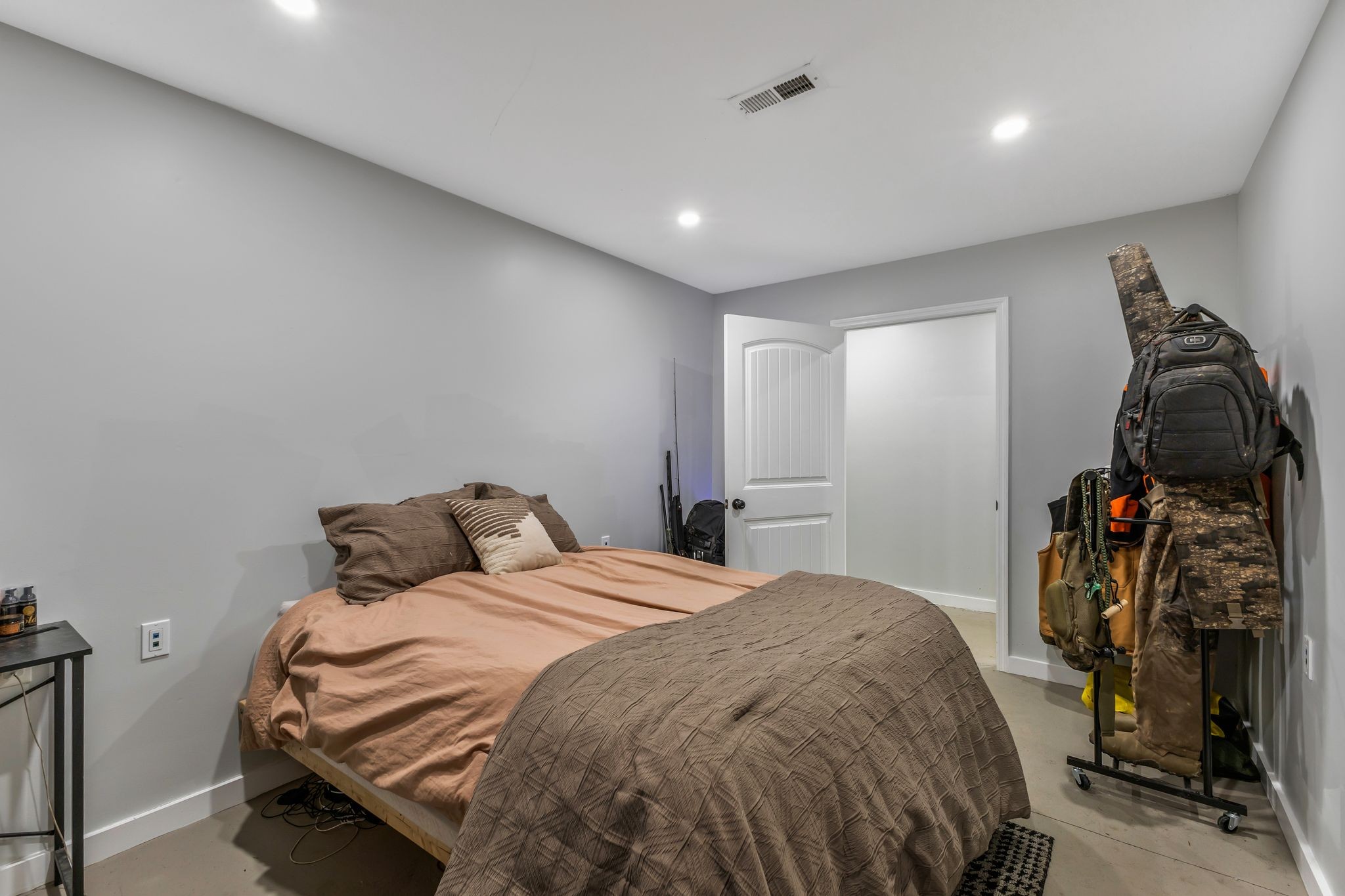 1745 Ennis Branch Road McEwen, TN 37101 - Photo 71 of 85 a bedroom with a bed and a walk in closet