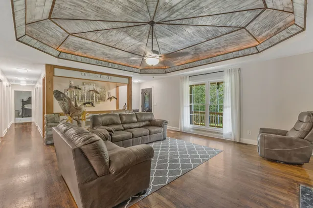 a bed room with a bed and a chair