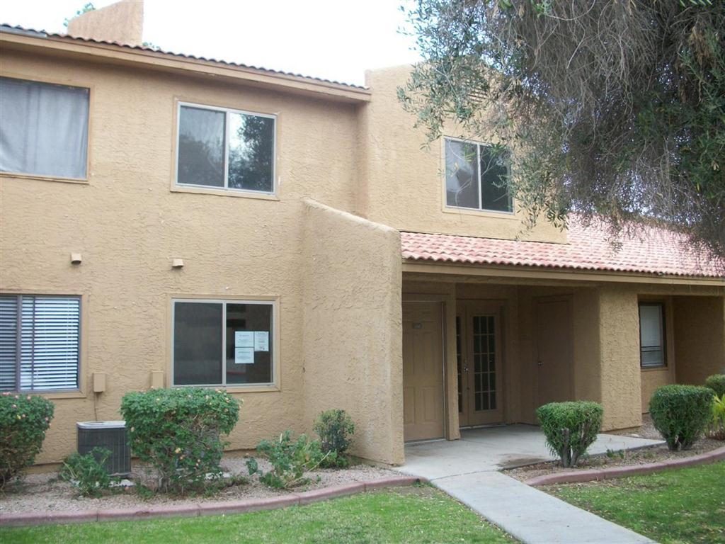 3511 East Baseline Road, Unit 1202 Phoenix, AZ 85042 - Photo 2 of 10 a front view of a house with garden