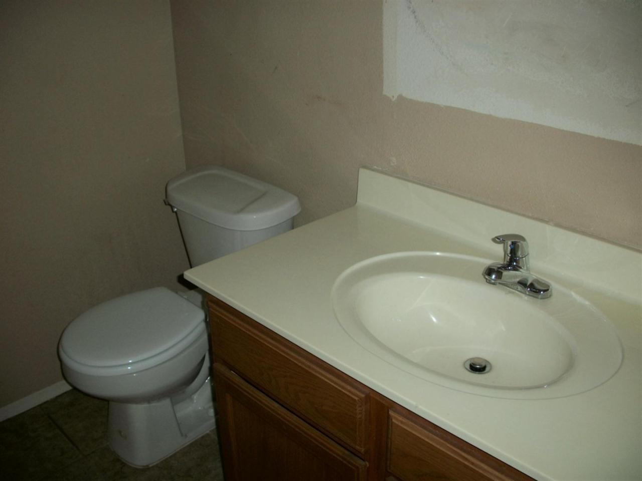 3511 East Baseline Road, Unit 1202 Phoenix, AZ 85042 - Photo 4 of 10 a bathroom with a toilet and a sink