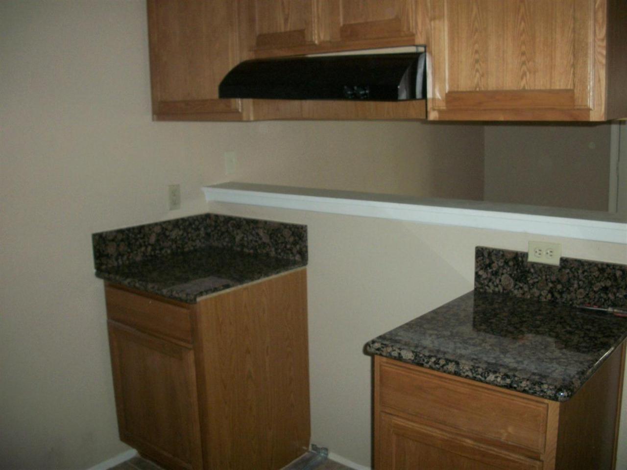 3511 East Baseline Road, Unit 1202 Phoenix, AZ 85042 - Photo 6 of 10 a kitchen with a sink and cabinets