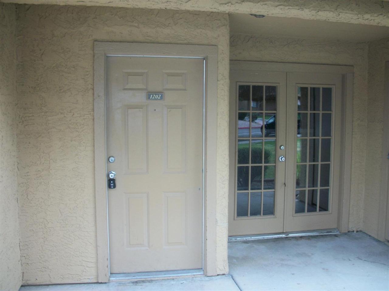 3511 East Baseline Road, Unit 1202 Phoenix, AZ 85042 - Photo 8 of 10 a view of front door of a house