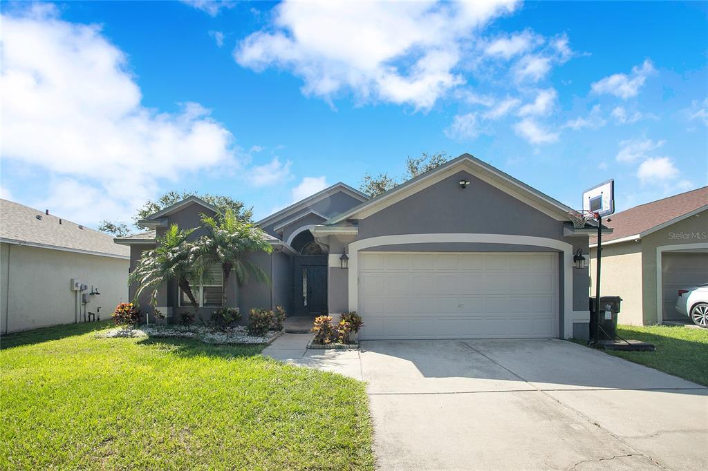 a front view of a house with a yard