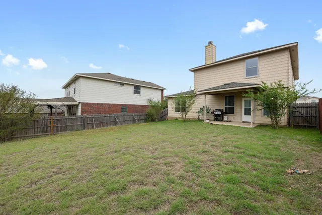 a front view of house with yard and seating area