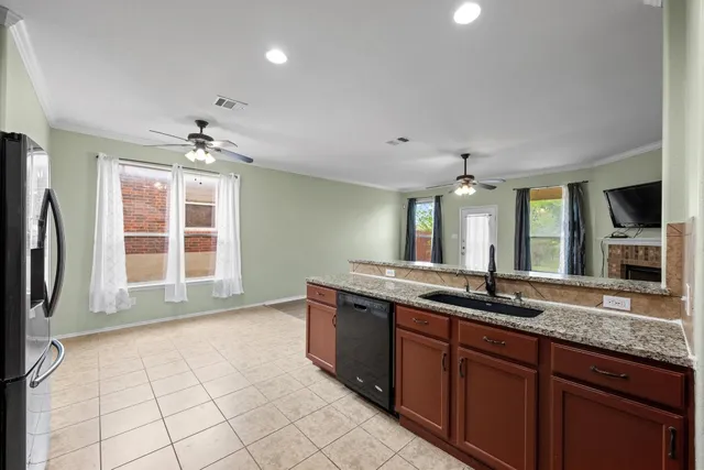 a view of a kitchen counter space and wooden floor