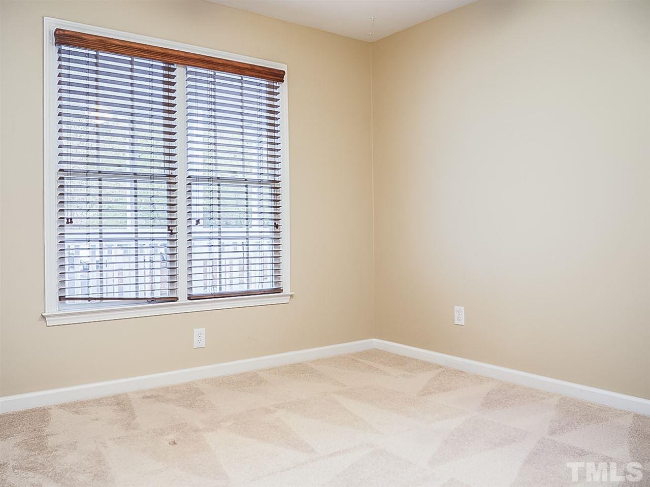 332 Springfork Drive Cary, NC 27513 - Photo 12 of 15 an empty room with a window
