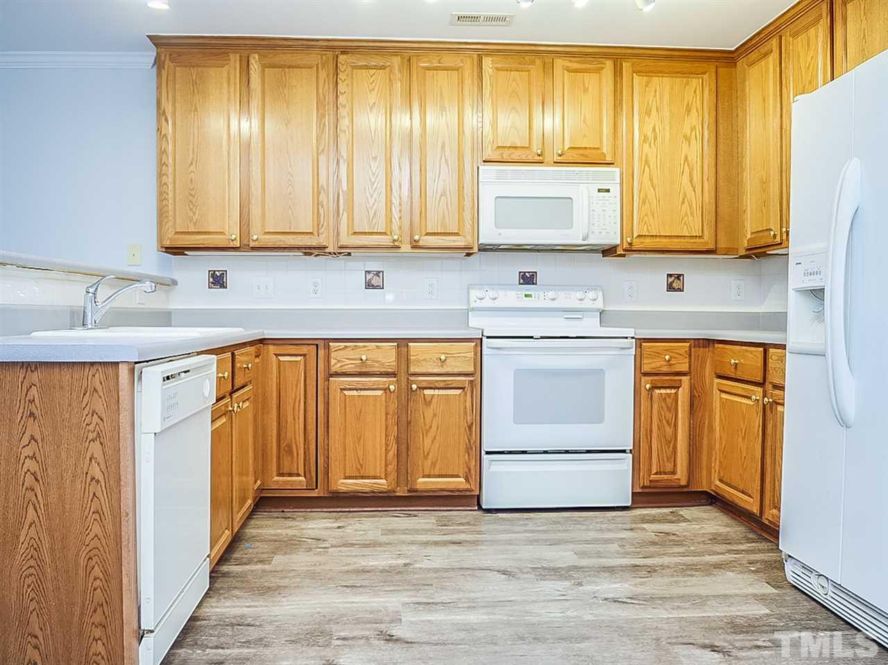 332 Springfork Drive Cary, NC 27513 - Photo 3 of 15 a view of a kitchen with a sink and cabinets