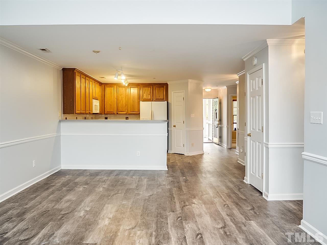 332 Springfork Drive Cary, NC 27513 - Photo 4 of 15 a view of a big room with a fireplace and windows