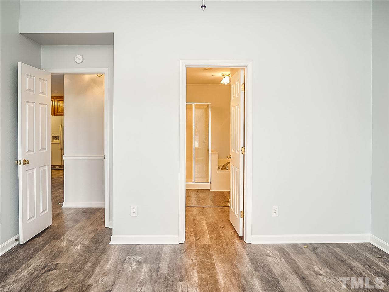 332 Springfork Drive Cary, NC 27513 - Photo 7 of 15 a view of a bathroom from a hallway