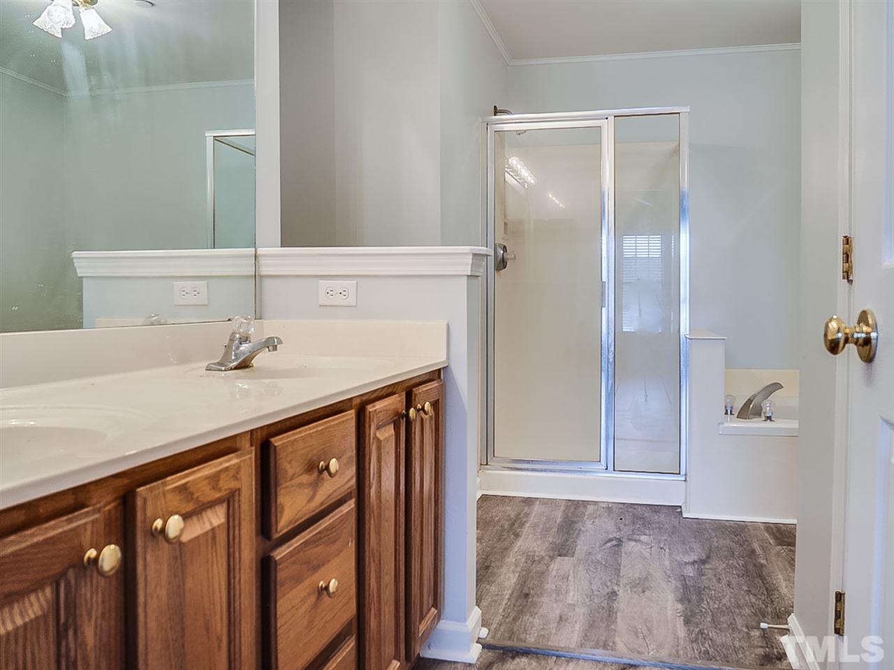 332 Springfork Drive Cary, NC 27513 - Photo 8 of 15 a bathroom with a sink and a mirror