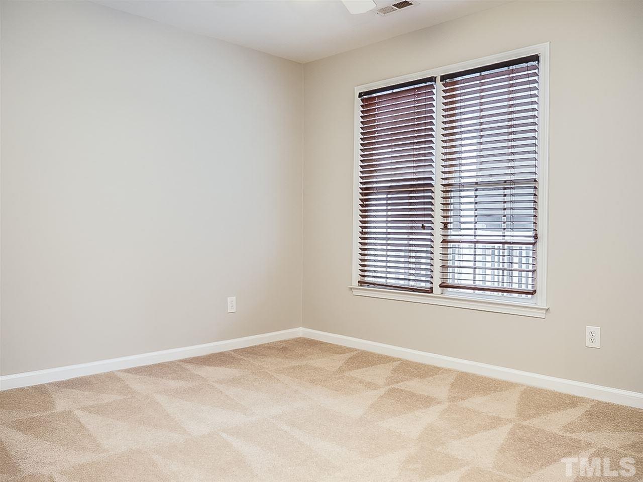 332 Springfork Drive Cary, NC 27513 - Photo 9 of 15 a view of an empty room with a window