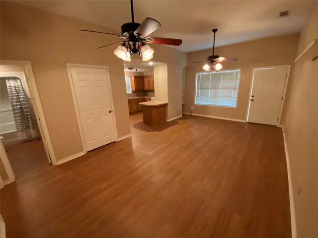 a view of a livingroom with a kitchen