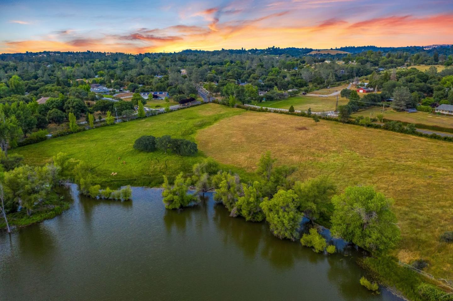 5800 Milton Ranch Road Shingle Springs, CA 95682 - Photo 1 of 21 a view of a lake with a mountain