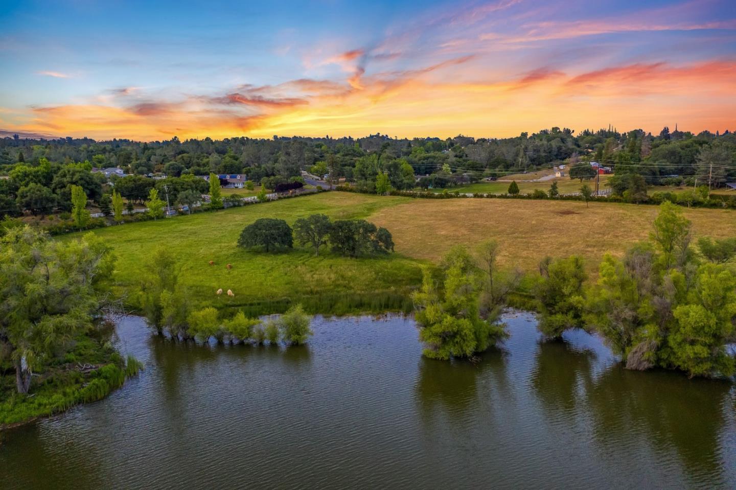 5800 Milton Ranch Road Shingle Springs, CA 95682 - Photo 7 of 21 a view of a lake with houses in back