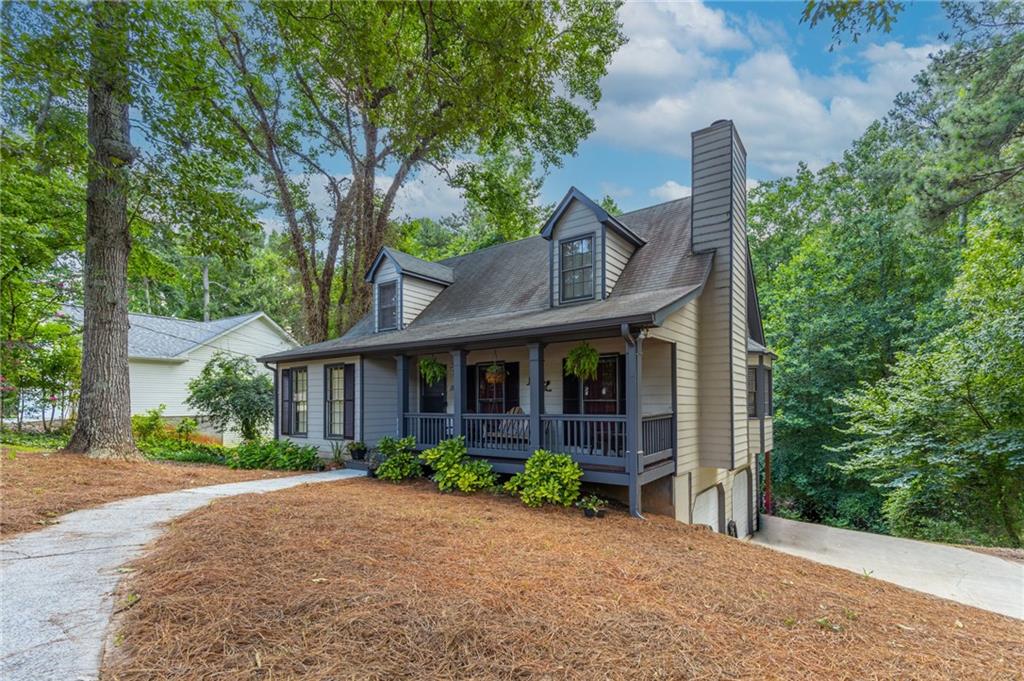 1561 Plunketts Road Buford, GA 30519 - Photo 1 of 1 front view of a house with a yard