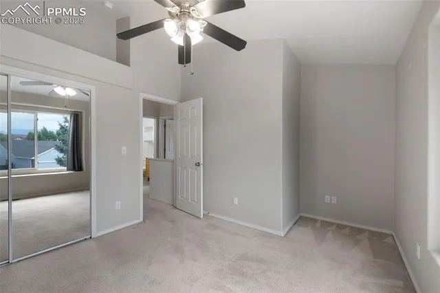wooden floor and chandelier fan in a room