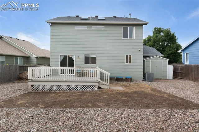 a view of a house with a fence