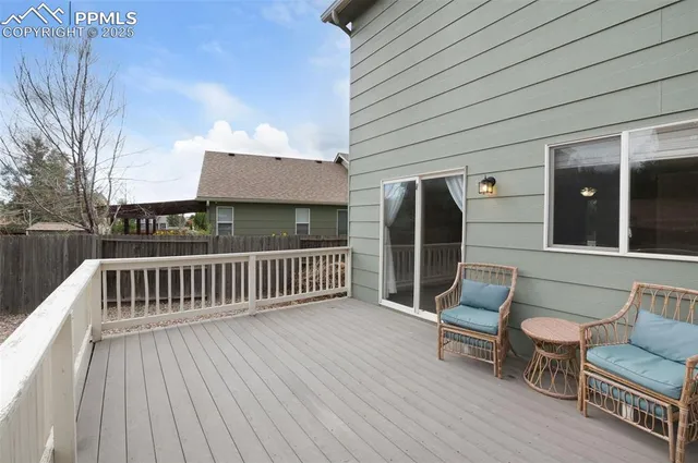 a view of two chairs in the balcony