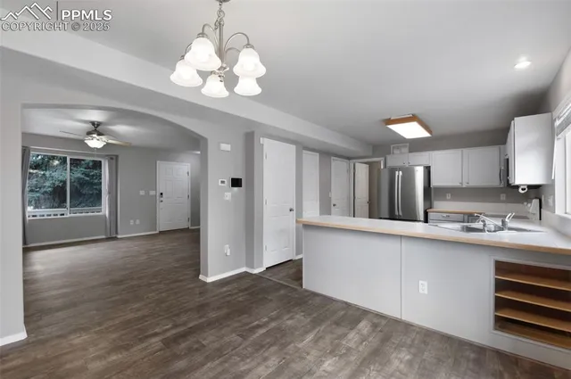 a view of a kitchen cabinets and wooden floor