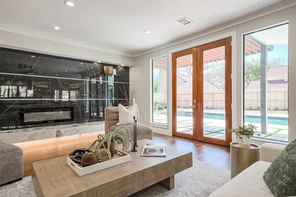 a living room with lots of furniture and kitchen view