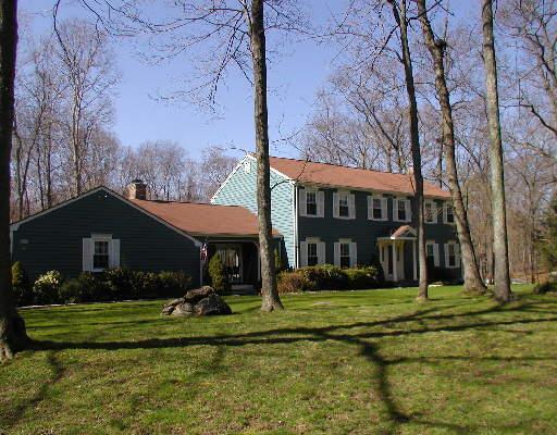 380 Fallow Field Road Fairfield, CT 06824 - Photo 1 of 1 a front view of a house with a yard