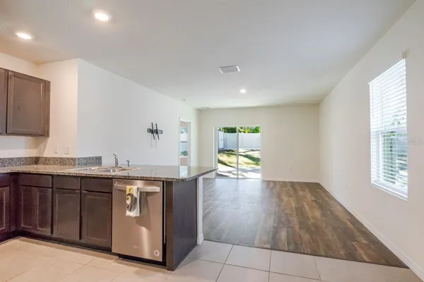 a view of a kitchen with a sink and a window