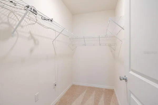 a view of a room with racks on the wall