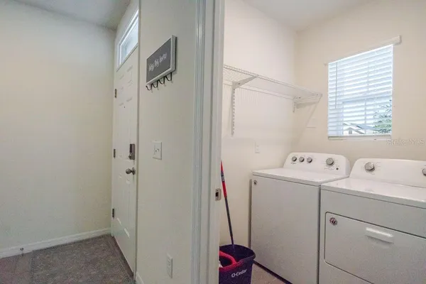 a view of storage and utility room with washer and dryer