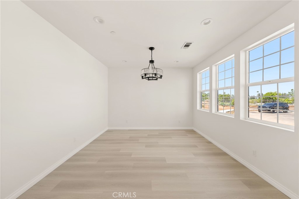 5978 Copperfield Avenue Riverside, CA 92506 - Photo 13 of 37 an empty room with a window