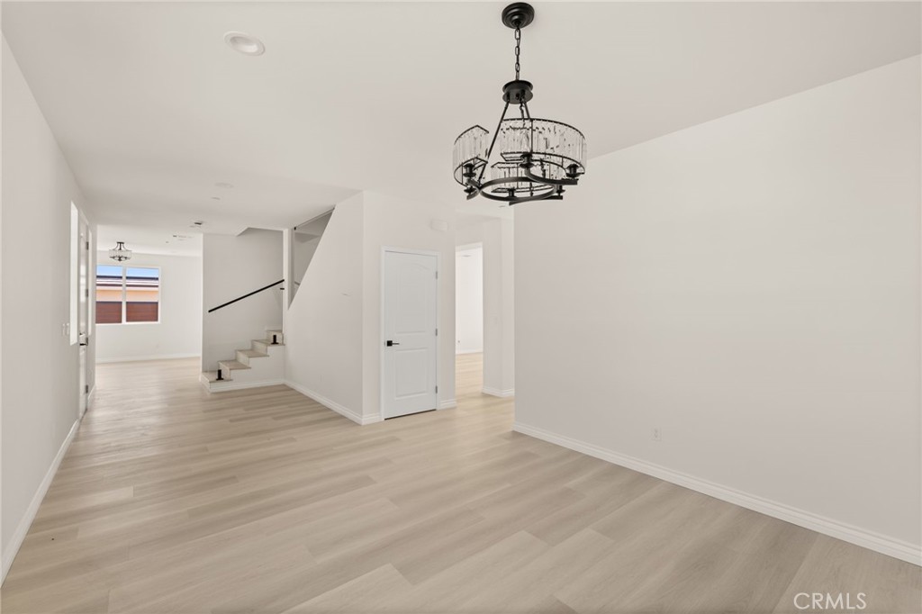 5978 Copperfield Avenue Riverside, CA 92506 - Photo 14 of 37 a view of a room with a wooden floor and window