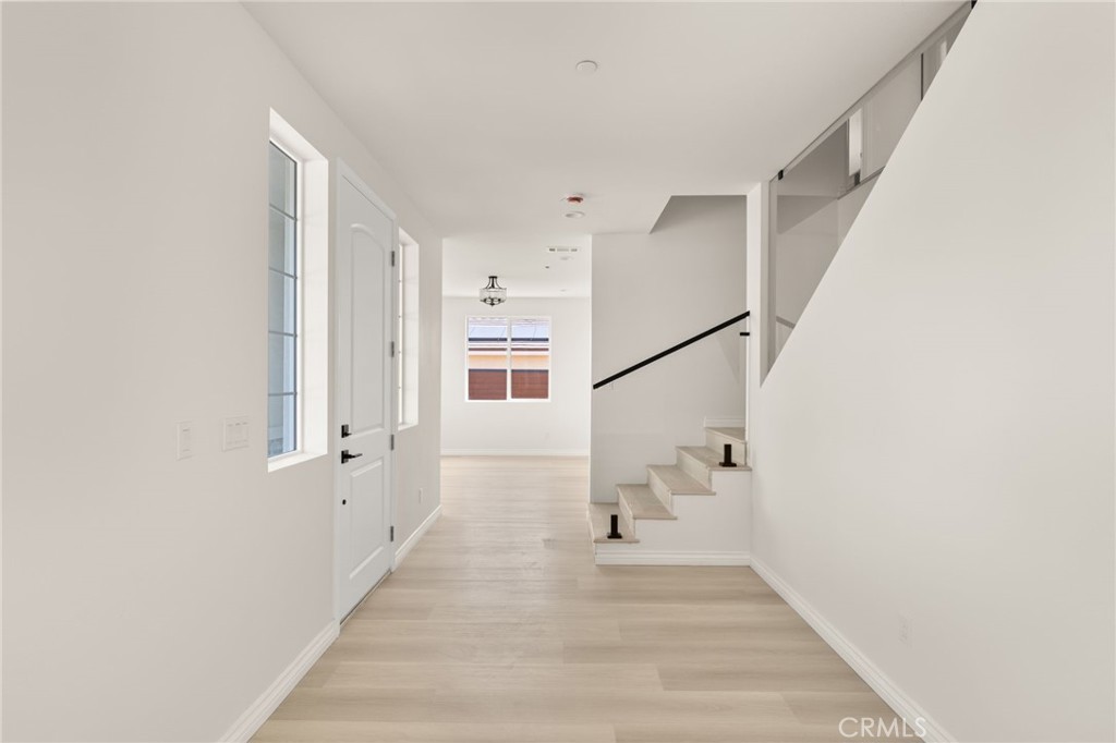 5978 Copperfield Avenue Riverside, CA 92506 - Photo 15 of 37 a view of an entryway with wooden floor