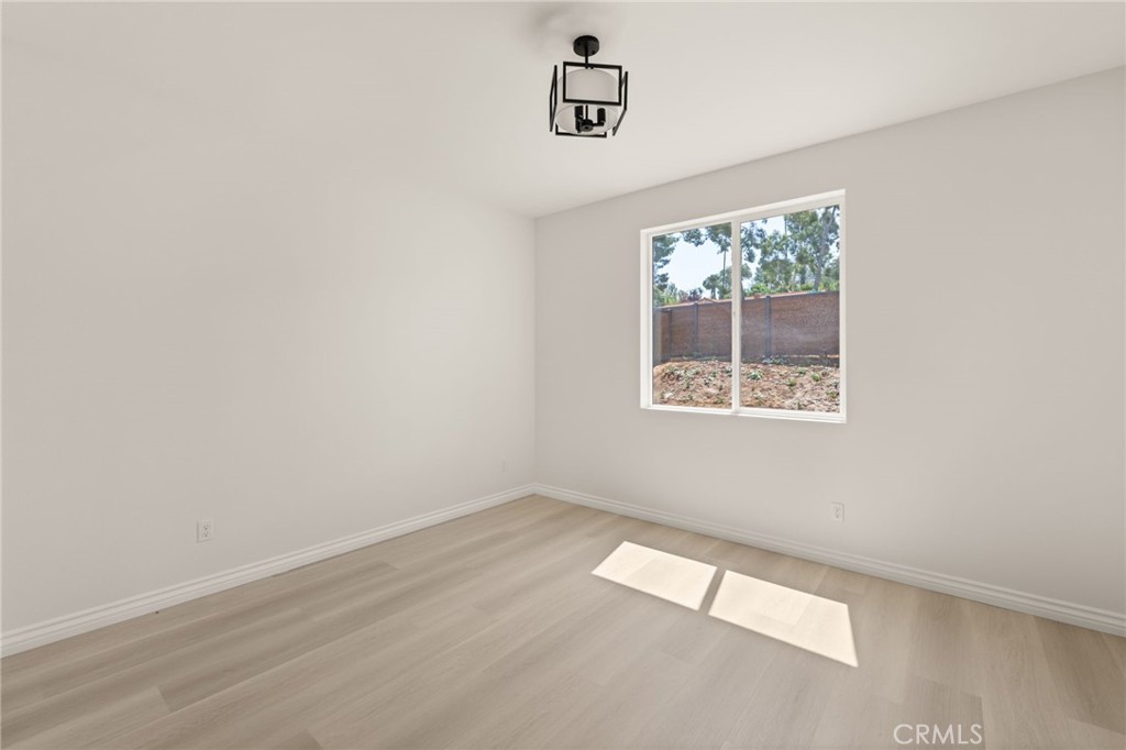 5978 Copperfield Avenue Riverside, CA 92506 - Photo 19 of 37 an empty room with a window