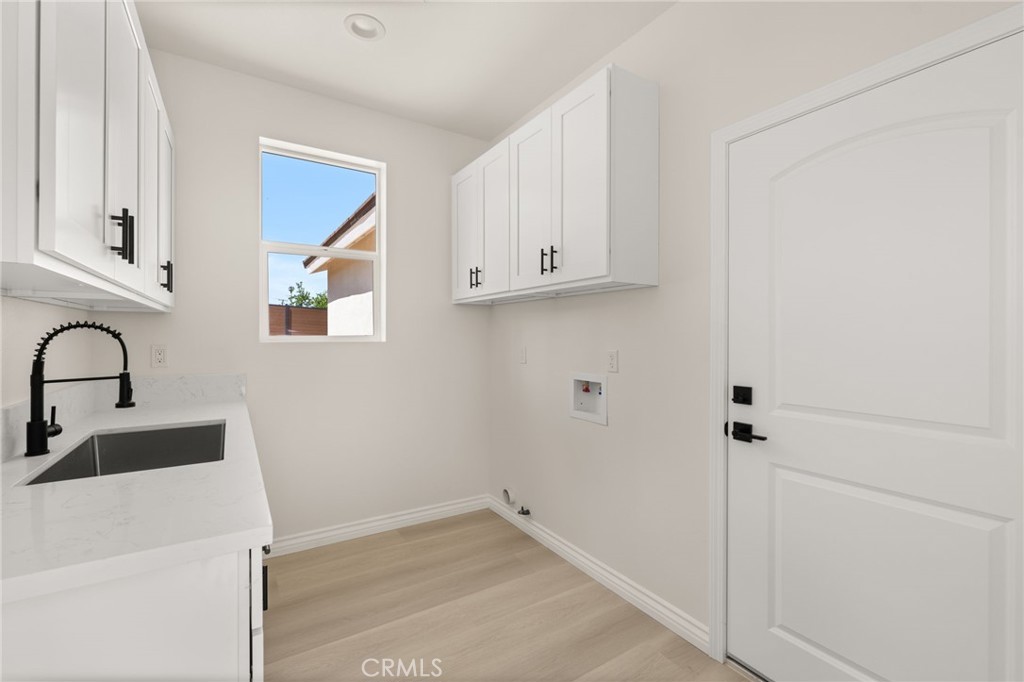 5978 Copperfield Avenue Riverside, CA 92506 - Photo 21 of 37 a view of a sink and cabinets