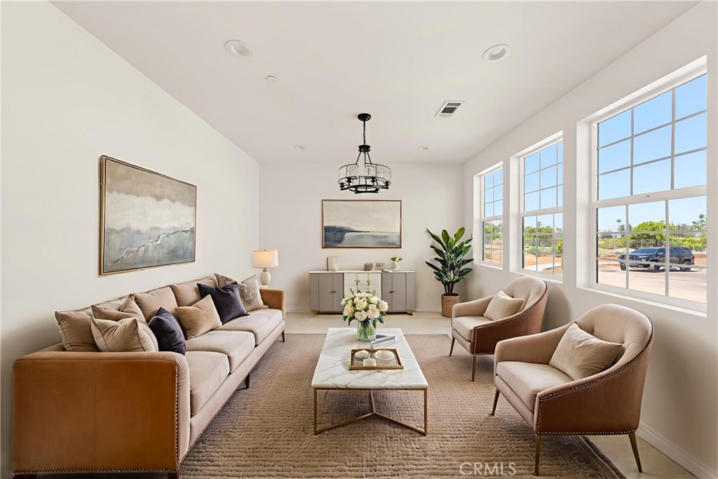 5978 Copperfield Avenue Riverside, CA 92506 - Photo 10 of 37 a living room with furniture and a large window