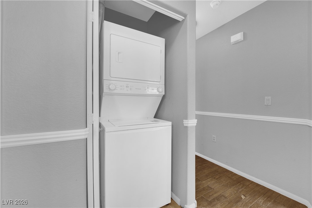2305 West Horizon Ridge Parkway, Unit 3512 Henderson, NV 89052 - Photo 14 of 29 Laundry room with estacked washer and dryer and light wood-style flooring