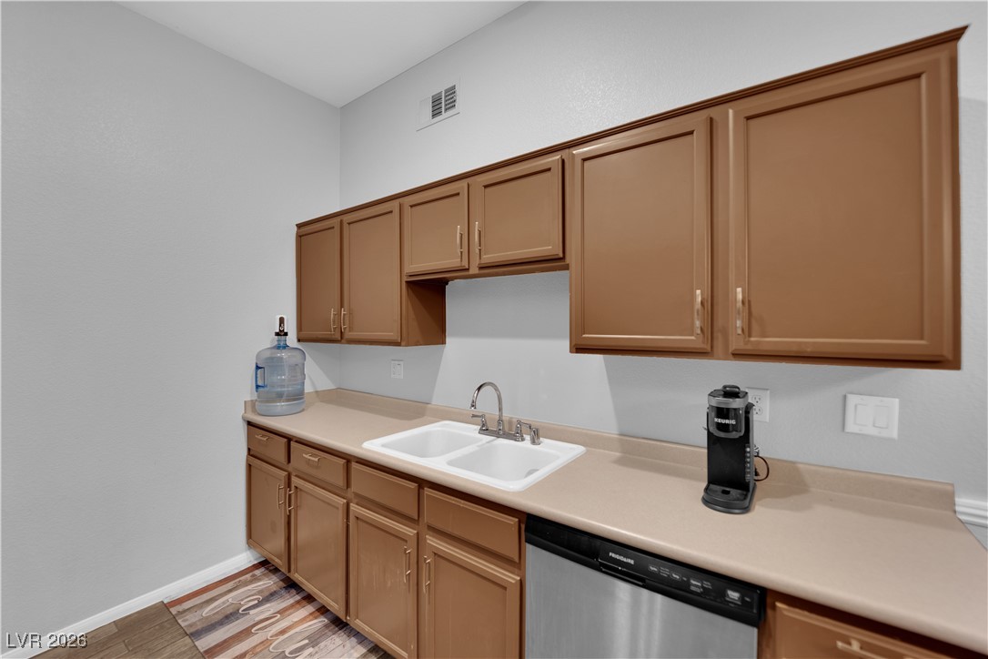 2305 West Horizon Ridge Parkway, Unit 3512 Henderson, NV 89052 - Photo 18 of 29 Kitchen with stainless steel dishwasher, light countertops, and light wood finished floors