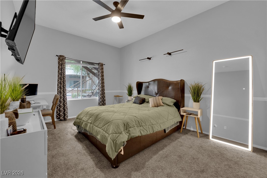 2305 West Horizon Ridge Parkway, Unit 3512 Henderson, NV 89052 - Photo 7 of 29 Bedroom featuring carpet, a ceiling fan, and a desk