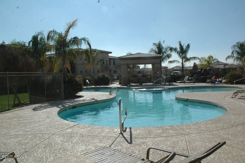 3330 South Gilbert Road, Unit 1039 Chandler, AZ 85286 - Photo 4 of 5 Pool and spa with Ramanda, waterfall